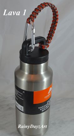 "~ Bold, Bright and Strong Paracord Water Bottle Handles ~  ~ Standard Water Bottle Handles ~  The perfect gift for the man or woman in your life! This tumbler handle is made with strong high quality American made 550 Paracord with a seven strand core. This paracord is uv resistant and will not mildew or rot. The clip is a 3\" durable, light weight aluminum d-ring carabiner. Carabiner is for handle only and should never be used for climbing.  Handle also includes a survival whistle. Great for hi Hiking Water Bottle, Paracord Dog Leash, Service Dogs Gear, Dslr Camera Straps, Tumbler Handle, Paracord Beads, Purple Camo, Orange Camo, Pink Snake