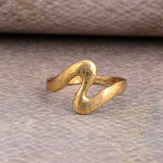 Unique Wave Ring Gold, Womens Oceans Wave Ring, Trendy Ocean Sea Wave Ring Brass, Women's Trendy Waves Brass Band SIZE :- All Size Are Available, choose from variation. METAL :- Brass ❥ Customers satisfaction is our biggest priority, please contact us with any questions/queries for future or existing orders, and we will do our best to make sure you are happy with your order. ♥ Please Make Sure to Include The Correct Address During Before Order. You Can return Item within 30 Days After Successful Vintage Gold Metal Rings, Vintage Metal Midi Rings As Gift, Vintage Metal Toe Ring Midi Rings, Vintage Hammered Jewelry For Gifts, Hand Forged Rings As Gift, Vintage Toe Ring Stackable Rings, Vintage Metal Midi Rings For Promise, Hand Forged Metal Rings For Anniversary, Vintage Hand Forged Metal Rings