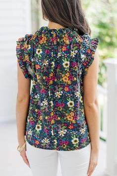 Meet your new favorite ditsy floral sleeveless blouse! This charming top pairs perfectly with shorts or jeans, making it ideal for so many different occasions. Its playful floral pattern and breezy design keep you looking stylish and feeling comfortable all day. Add this versatile piece to your wardrobe for an effortlessly chic summer look! Round neckline Button keyhole back Sleeveless cut Ruffled detailing Ditsy floral print No stretch Cindy is wearing the small. Summer Cotton Blouse With Ditsy Floral Print, Summer Cotton Tops With Ditsy Floral Print, Summer Floral Print Patterned Blouse, Cotton Ditsy Floral Print Summer Tops, Cotton Tops With Ditsy Floral Print For Summer, Trendy Cotton Tops With Ditsy Floral Print, Trendy Summer Top With Ditsy Floral Print, Cotton Ditsy Floral Print Top For Day Out, Trendy Summer Tops With Ditsy Floral Print