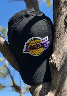 Pull on this Los Angeles Lakers Team Classic 39THIRTY Black Flex Hat just in time for the game! This LA Lakers Lakers Flex Hat features a team logo embroidered on the front. Front raised embroidered team logo, Secondary team logo embroidered on back, 100% woven polyester, Flexible-fit 39THIRTY sizing, New Era flag embroidered on the left side, Pre-curved bill, Structured crown, Polyester, Washable, Imported Black Trucker Hat With Letter Print For Fans, Black Embroidered Logo Fitted Hat For Outdoor, Black Fitted Hat With Embroidered Logo For Outdoor, Black Hats With Letter Print For Fan Gear, Black Dad Hat For Sports Events, Black Fitted Hat With Letter Print For Sports Events, Black Fitted Hat With Letter Print For Sports, Black Fitted Hat With Letter Print And Curved Visor, Black Baseball Cap With Letter Print For Game Day