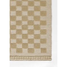 a beige and white rug with squares on it