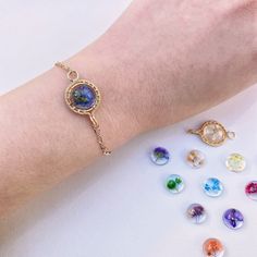 this dainty bracelet has been carefully handcrafted and can come in your choice of birth flower, there are perfect and special gift for everyone  ❤️ M E A S U R E M E N T S  : -  LENGTH: Approx. 19cm + 5cm extender - If you would like another length, please leave a note with your order with the length you require ❤️M A T E R I A L : - Eco resin. - Pressed flowers -  14K Gold wire ❤️ A B O U T Me All pieces are designed and made by me in Australia. I am in love with the wild botanical, Therefore Gold Flower Friendship Bracelet As Gift, Spiritual Flower-shaped Bracelets For Gift, Spiritual Flower Bracelets For Gifts, Spiritual Flower-shaped Bracelets As Gifts, Rose Gold Bohemian Bracelet As Gift, Delicate Adjustable Round Charm Bracelet, Flower Charm Bracelets As Gifts, Bohemian Nickel-free Friendship Bracelets As Gift, Dainty Adjustable Bracelet With Flower Charm