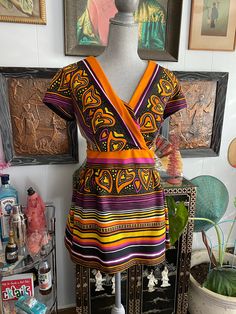 "Fun vintage 70's era hand made top with great colors! Purple, orange, black, yellow with abstract hearts and stripes. This top is a heavier weight unlined polyester and the top has a back zipper. The front of the top has a V'd criss cross bustling and the top has a longer peplum. It is super cute and flattering on. Top has short sleeves.  Measurements when flat and unstretched are: 18\" across bust 15\" across waist 14.5\" across back shoulders  29\" long Top is in excellent condition with no i Sassy Pants, 70s Era, Favorite Handbags, Colors Purple, Vintage Color, Peplum Blouse, Purple Orange, Top Hat, Vintage Colors