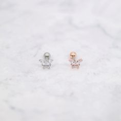 ⇢⇢ PLEASE READ BEFORE PURCHASING ⇠⇠ ✧✧ This listing is for ONE piece only ✧✧ PLEASE BE AWARE of your own ear piercing size!! Everyone has different sizes and shaped ears, with different gauge sizes, so our suggestion may NOT be for everyone. 💜 Item Details 💜 ✧ Thickness: 16 Gauge (1.2mm) ✧ Top Size: 7mm x 6mm ✧ Externally Threaded ✧ For: Cartilage, Tragus, Helix, Conch ✧ Colors: Rose Gold / Silver ✧ Ball Back (4mm) ✧ 1 Piece ✧ If you wanted a 3mm ball end (Silver color only), please leave me a Rose Gold Drop Cartilage Earrings Single Earring, Rose Gold Drop Cartilage Earring, Drop Earrings Piercings For Gift, Rose Gold Pierced Ear Cuff As Gift, Dainty Rose Gold Single Cartilage Earring, Rose Gold Single Earring Ear Cuff As Gift, Delicate Rose Gold Single Cartilage Earring, Rose Gold Single Ear Cuff As Gift, Minimalist Ear Piercings As A Gift