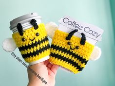 two crocheted coffee cozies are held up to show the same pattern