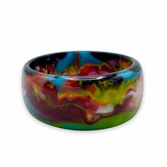 Chunky bangle bracelet with colorful marbled design 2.5"D Made from colored resin Note: Each piece is handmade and one-of-a-kind. Patterns and coloring will vary Free shipping! Designed in South Florida and made in Brazil. Multicolor Bangle Bracelets In Wearable Art Style, Multicolor Wearable Art Bangle Bracelets, Multicolor Wearable Art Bracelet For Gift, Artistic Multicolor Bangle Bracelet, Multicolor Hand Painted Bangle Bracelets, Multicolor Hand Painted Bangle Jewelry, Multicolor Hand Painted Bangle Bracelet, Hand Painted Multicolor Bangle Jewelry, Hand Painted Multicolor Bangle Bracelet