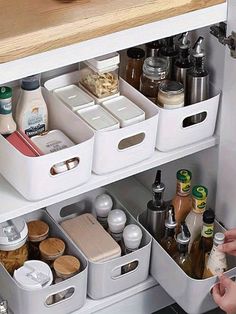 a kitchen cabinet filled with lots of food