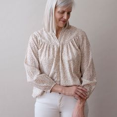 About Our Isobel top is super soft, flowy, oversized and flattering on everyone. S/M: 21.5" wide, 22" long L/XL: 24" wide, 24.5" long 100% lightweight cotton Block printed with non-toxic, azo free dyes Process Our designs are hand carved into teak wood blocks, and then hand block printed onto soft cotton. We use water based, non-toxic, AZO-free dyes. Every step of our production is done by hand in small batches by a network of artisans in Jaipur. Care -Machine wash cold with like colors-Dry on l Spring Bohemian Blouse For Loungewear, Cream Floral Print Top For Daywear, Flowy Cotton Tops For Loungewear, Feminine Peasant Top For Fall Daywear, Bohemian Relaxed Fit Blouse For Loungewear, Billowy Cotton Feminine Blouse, Floral Print Relaxed Fit Tops For Loungewear, Flowy Blouse For Spring Loungewear, Billowy Cotton Blouse Feminine Style