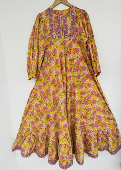 "Cotton maxi, long dress, floral dress, boho dresses, hippie dresses, dress with border, bohemian maxi, vintage gown, yellow maxi, umbrella maxi, marigold dress for special occasion, gift for her, dresses with border, INDIAN dresses, cotton dresses, floral dress, border dresses, printed dress, long maxi, indian wholesale dresses, indian seller, indian cotton maxi     Feel beautiful and confident throughout your days wearing our block printed outfits, made with high quality soft and breathable cotton fabric.  The print on the dress is known as \"BLOCK PRINT\" which is centuries old technique of Indian textile carried out  by local artisans of Jaipur (INDIA) MEASUREMENTS (in inches): Size XXS-: Bust- 34″ | Shoulder- 13.5″ | Length- 51″ Size XS-: Bust- 36″ | Shoulder- 14″ | Length- 51″ Size S Spring Anarkali Embroidered Maxi Dress, Multicolor Anarkali Maxi Dress For Spring, Spring Anarkali Maxi Dress, Long Anarkali Festival Dress, Traditional Embroidered Maxi Dress For Spring, Yellow Bohemian Boho Dress With Floral Print, Yellow Bohemian Dress With Floral Print, Floor-length Boho Print Maxi Dress, Multicolor Boho Print Floor-length Maxi Dress