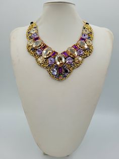 Each piece of our statement necklaces is handmade and one of a kind made in Italy. Our creations is made of high quality materials such as crystals and rhinestones. Each embroidered material is carefully hand sewn. Very glamorous and stylish. Perfect gift to someone you like. Materials Strass stone and Rhinestone in Violet, Crystal Golden Shadow and Violet Blue color in different dimension.  Black satin fabric backing. Aluminium chain with lobster closure. Measurements Weight approximate 200 grams. Chain lenght 25 cm - 9.84 in Circumference approximate 63 cm - 24.80 in Feel free to contact us if you have any question. Thank you so much for looking at our shop and our articles each of them, single piece. Luxury Choker Necklace For Party, Luxury Party Choker Necklace, Luxury Gold Beaded Necklace For Party, Crystal Jeweled Necklaces For Celebration, Luxury Rhinestone Necklaces For Parties, Luxury Handmade Beaded Necklaces For Party, Handmade Luxury Beaded Necklace For Parties, Luxury Crystal Embellished Jewelry As Gift, Luxury Handmade Beaded Necklace For Party