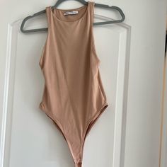 This Color Is No Longer Available On Zara Website. New Without Tags Never Been Worn Color: Nude Size: Small Casual High Neck Bodysuit For Summer, Casual High Neck Summer Bodysuit, Sleeveless Beige Bodysuit For Summer, Chic Sleeveless Beige Bodysuit, Zara Trendy Sleeveless Bodysuit, Trendy Zara Sleeveless Bodysuit, Zara Stretch Casual Bodysuit, Zara Casual Stretch Bodysuit, Trendy Sleeveless Zara Bodysuit