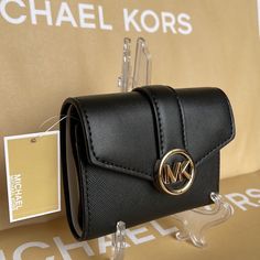 Michael Kors Carmen Medium Logo And Faux Leather Wallet Black All Our Listed Item Are Authentic, Brand New Condition With Tag Size: Approximately 4.89 Wide X 3.67 Long X 1.63 Thick (Inch) Weight: Approximately 120 G Material: Leather Opening And Closing Type: Snap Internal Style: Zipper Coin Purse X 1, Wallet X 1, Open Pocket X 2, Card Pocket X 6 External Style: 1 Open Pocket 35s2gnmf6l Zipper Coin Purse, Media Logo, Michael Kors Black, Michael Kors Bag, Leather Wallet, Coin Purse, Coin, Michael Kors, Faux Leather