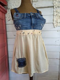 Women's denim bib overall top, size M.  Made using upcycled Free People skirt and Banana Republic denim jeans.  All embroidery is completed by hand.  Top measurements are:  denim bib 6.5" from top to waist, full length of top is 22.5".  Straps from bib front top to back are 21".  Circumference of elastic waist is 31". Upcycled Denim Jeans For Summer, Summer Denim Top With Patchwork, Medium Wash Cotton Denim Top With Patchwork, Medium Wash Denim Top With Patchwork, Upcycled Cotton Jeans For Summer, Summer Upcycled Cotton Jeans, Free People Skirt, Free People Denim, Bib Overalls