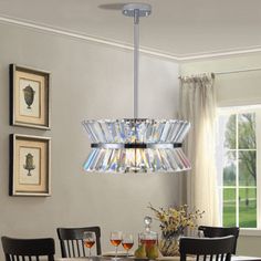 a chandelier hanging over a dining room table