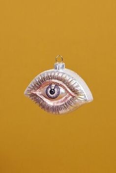 a silver ornament with an eye on it