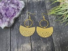 These geometric statement earrings feature 38mm x 23mm textured wavy brass fan charms dangling from 20mm gold-plated brass circles. The ear wires are made from gold-plated surgical steel, making these earrings safe for sensitive ears.They are very lightweight and measure approximately 2 and 3/8 inches from the top of the ear wire to the bottom of the half circle charm.Domestic shipping is always free here at Mayamadethis! Textured Metal Drop Earrings, Geometric Rose, Rose Gold Quartz, Rose Quartz Earrings, Half Circle, Crazy Lace Agate, Bar Earrings, Quartz Earrings, Brass Earrings