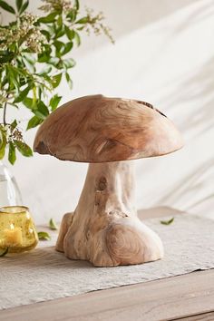 a wooden mushroom sitting on top of a table