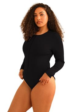 Take a dive into style with the Shoal One Piece! This one-piece is perfect for taking a dive into the fashion world with its long sleeve design and relaxed fit. Enjoy the coziness of the fabric while you look your best. Get ready to make a splash in the Shoal One Piece! 88% Nylon 12% Spandex Imported from Vietnam Moderate coverage Front zipper Long sleeve Black Long Sleeve Bodysuit With Zipper, Black Long Sleeve Bodysuit With Zipper Closure, High Stretch Long Sleeve Bodysuit With Zipper, High Stretch Long Sleeve Bodysuit With Zipper Closure, Casual Long Sleeve Solid Swimwear, Black Stretch Swimwear With Zipper, Casual Black Long Sleeve Swimwear, Casual Long Sleeve High Stretch Swimwear, Hairstyling Products