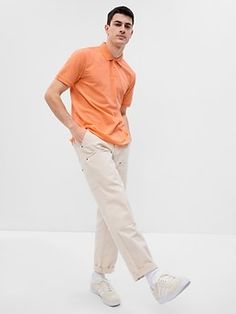 Soft, stretch pique knit polo.  Flat rib-knit polo collar.  Short sleeves with flat rib-knit cuffs.  Button placket.  Side vents at hem.  #586313 Straight, easy fit.  Hits at the hip.  Models are 6'1"–6'2" 185-188 cm) with a 31" 79 cm) waist and 32–33" 81–84 cm) inseam, and are wearing Gap Creative Poses, Knit Polo, Preppy Casual, Pique Polo Shirt, Men Fits, Oxford Shirt, Polo Collar, Knit Cuff, Button Placket