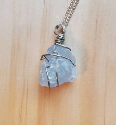 This amazing pendant is made with natural Blue Celestite and hangs from an 18 inch chain.Celestite crystal inspires deep relaxation by restoring your natural state of joy. Keep a stone near you to bring tranquility and harmony into your space.>SIZE: Stones are about one inches.>PROCESSING TIME: Your necklace will ship within 1-3 business days after purchase.>SHIPPING TIME: 2-5 days within the US via USPS First Class Mail.>GIFTS: We would love to ship your necklace directly to your gi Quartz Crystal Necklace With Raw Stone For Healing, Blue Moonstone Gemstone Crystal Necklace, Blue Wire Wrapped Crystal Necklace For Healing, Minimalist Raw Stone Crystal Necklaces For Healing, Minimalist Raw Stone Crystal Necklace For Healing, Blue Mineral Crystal Necklace For Gift, Gift Moonstone Necklace With Raw Stone, Blue Raw Stone Crystal Necklace Gift, Blue Raw Stone Crystal Necklace As Gift