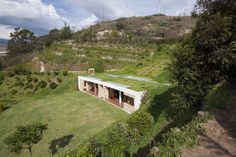 an aerial view of a house in the hills