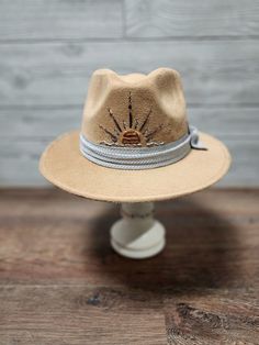 Custom caramel suede fedora with embroidered sun and polyester handmade bow. Size S/M is 55.5cm - 58cm 6cm brim length. Hat band inside the hat for a very comfortable and great fit. Western Fedora With Flat Bill For Spring, Western Style Fedora With Flat Bill For Spring, Country Style Wide Brim Felt Hat For Beach, Casual Felt Hat For Summer Outdoors, Brimmed Felt Hat For Outdoor Spring Activities, Spring Brimmed Felt Hat For Outdoor, Casual Summer Felt Hat For Outdoor, Spring Outdoor Brimmed Felt Hat, Western Felt Hat With Curved Brim For Vacation