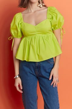 Elevate your wardrobe with our Tied Strap Puff Sleeve Woven Top. Featuring a stylish tied strap detail and on-trend puff sleeves, this top is perfect for any occasion. The smocked back adds a touch of flair, while the lining provides a comfortable fit. Made with high-quality materials, this top is a must-have for any fashion-forward individual. From casual outings to special events, this top will make you stand out in the crowd. Pair it with your favorite jeans or skirts for a chic and effortles Cotton Top Design, Cotton Tops Designs, Fashion Top Outfits, English Factory, Summer Special, Woven Top, Leather Dresses, Top Design, Plus Dresses