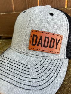 Looking for something different to buy your Daddy?  Gift one of our custom made hats to the Daddy in your life! You get to choose the color of hat, and then we make the Genuine Leather Daddy patch in house from only the finest leather. These hats are custom to our shop and we make them when you order!  Make sure and browse our selection of women's hats too! Quality and Customer Service are our Top Priority, so please message us with any questions! We are a new shop on Etsy, but we are an established small business in McKinney, TX. Feel free to look at our FB page for a wide range of our work. https://www.facebook.com/restoringwithlove/ Font: Daddy will be in the font shown in the pictures unless you message us prior to ordering and request something different. Hats: Choose the hat color yo Adjustable Trucker Baseball Cap With Letter Patch, Curved Bill Trucker Hat With Letter Print As Gift, Letter Print Snapback Trucker Hat For Gift, Letter Print Snapback Trucker Hat As Gift, Letter Print Trucker Hat As Gift, Letter Print Trucker Cap As Gift, Letter Print Hat For Father's Day Gift, Letter Print Snapback Trucker Hat, Brown Trucker Hat With Letter Print