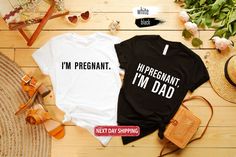 two shirts that say i'm pregnant and i'm dad