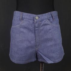 "These are nice vintage shorts, made in Germany in the 70s. The shorts are made of soft fabric, they are comfortable. They have front and bottom pockets. MAKE: Made in Germany. CONDITION: Excellent. MATERIAL: 86% cotton, 14% viscose. MEASUREMENTS NOTE: Please refer to the exact measurements and sizing table I used, as this one does not have size labels! The mannequin is size XS. Waist: 75cm/29.5\" Hips: 90cm/35\" Length: 30cm/12\" Crotch to \"belt\": 27cm/10.5\" All my items are preloved vintage and retro items, unless stated differently. Colours may look different on each viewing screen. All items are sold \"as is\" so if you have any additional questions about this item, please don't hesitate to ask before purchasing. My passion is hunting for interesting, unique and vintage items for yo Retro Denim Bottoms With Built-in Shorts, Fitted Denim Blue Jean Shorts, Medium Wash Cotton Bottoms For Festival, Festival Denim Blue Cotton Bottoms, Denim Blue Cotton Bottoms For Festival, Medium Wash Cotton Shorts, High Waist Fitted Denim Blue Shorts, Fitted Denim Shorts For Festivals, Denim Blue Shorts For Summer