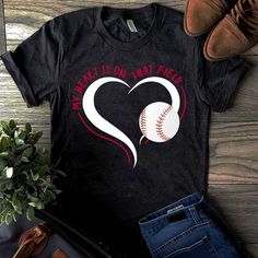 a t - shirt with the words what is on my heart? and a baseball inside it