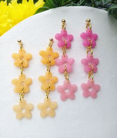 Spring Collection  ♡ Flower chain earrings - with gold plated stud posts  Size of flowers: 1.5 x 1.5cm Total Length of earring: 7cm Gold plated studs/jump rings/ Lead/Nickel Free Perfect for every day but also for a unique outfit. Available in Pink and Orange Materials: Translucent clay, gradiented pink/orange These polymer clay earrings are handmade in Manchester, UK by me. Due to their handmade nature, there may be slight variations compared to the picture and there may be minor imperfections Polymer Clay Flower Earrings, Clay Flower Earrings, Translucent Polymer Clay, Flower Chain, Stock Flower, Marble Earrings, Clay Flower, Rose Orange, Makeup Stain