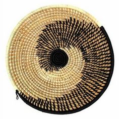 a black and white woven basket on a white background with an oval design in the center