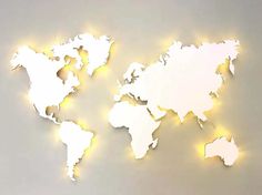 a world map is shown with lights on the wall