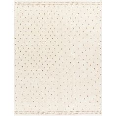 a white rug with gold dots on it