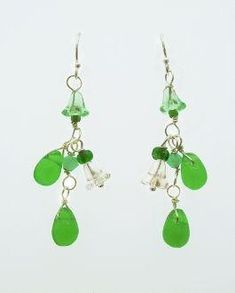 These playful green dangling earrings evoke memories of springtime flowers. Colors range from a clear bead, soft green raindrop shaped beads and dark green accents. Earring falls 1.5 inches past lobe and has sterling silver hooks. Green Dangle Earrings, Green Accents, Dangling Earrings, Jewelry Inspo, Green Bead, Spring Time, Dark Green, Dangle Earrings, Drop Earrings