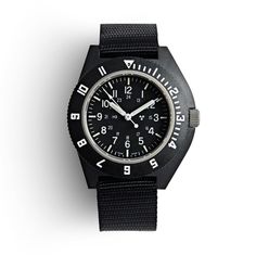 In 1986, Kelly Air Force Base needed watches that could withstand extreme changes in pressure, be used at high altitudes, and remain legible and accurate in the process. This watch was created to meet those demands. Handmade in Switzerland and designed for pilots and parachute missions, this watch has been issued and worn by troops in Iraq and Afghanistan. A detachable compass with a glow-in-the-dark bezel furthers the military feel. The watch features a lightweight, specialized fiber shell case Air Force Base, Nato Strap, High Altitude, Swiss Made, Black Watch, Pilots, Low Lights, The Process, Quartz Movement