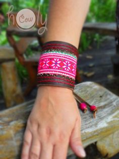 This hippie bracelet is 100% handmade from the finest quality brown leather. It is beautifully designed with vintage Hmong fabric on the front. No sewing machines or assembly lines are in sight. The Hmong tribe are an ethnic hill tribe group which live near me in the mountains in the north of Thailand. The fabric insert used in this bracelet is Hmong vintage tribal tapestry which is beautifully cross stitched. The Hmong people are believed to have been the original inhabitants of the Yellow Rive Brown Bohemian Bracelets For Festivals, Red Adjustable Leather Bracelet, Bohemian Style, Adjustable Brown Bracelet For Festivals, Adjustable Brown Bracelets For Festivals, Traditional Leather Jewelry For Festival, Hippie Brown Leather Festival Bracelet, Traditional Handmade Leather Bracelets, Bohemian Hand-tooled Cuff Bracelet, Adjustable Leather Hippie Bracelet For Festivals