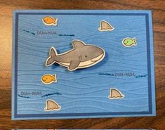 a card with an image of a shark and other marine creatures on it, along with the words happy birthday