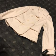 Guess Brand Pea Coat. Size Small. Super Cute, Warm And Cozy. Jacket Brand New. Never Worn W/ Tags. Has A Light Spot On Back Of Outer Neck Collar And Some Faint Markings On Left Lower Back - See Photos. Depends On Room Lighting If Visible Or Not. Fitted Double-breasted Spring Pea Coat, Chic Fitted Single Breasted Pea Coat, Fitted Beige Pea Coat With Button Closure, Cream Pea Coat For Work, Elegant Fitted Beige Pea Coat, Winter White Pea Coat For Work, Fitted Cream Pea Coat For Work, Fitted Beige Pea Coat For Work, Elegant Cream Pea Coat With Long Sleeves