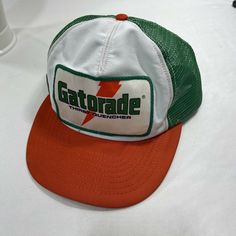 Vintage Gatorade Big Patch 3 Tone trucker Style SnapBack Hat. Conditioners preowned. Shipped. first class. (Up) Vintage and rare, early Gatorade Trrucker Mesh snapback hat. Hat is in overall very good conditions. Relative to its age. Small stain in the front right brim of the hat. May come out with additional work. If you have questions or need additional pictures, please ask before bidding. Cleaned and sanitized. From a pet free, smoke-free home. Please follow us on Ebay for coupons on unique i Green Vintage Trucker Hat For Outdoor, Vintage Green Trucker Hat For Streetwear, Vintage Trucker Hat Baseball Cap For Streetwear, Vintage Trucker Hat For Streetwear, Vintage Snapback Trucker Hat For Streetwear, Vintage White Trucker Hat For Outdoor, Artist Merch, Custom Trucker Hats, Orange Hats