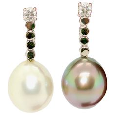 Charming diamond earrings set with natural white and gray South Sea pearl, Tahitian pearl. 18 Karat White Gold. The Pearls each have a diameter of approx. 11.8 mm Includes certificate of authenticity. Sea Pearl, South Seas, South Sea Pearls, Sea Pearls, Tahitian Pearls, Tahiti, Earring Set, Gold Diamond, Jewelry Earrings Dangle