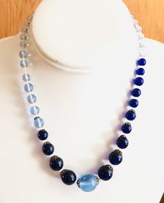 "French glass graduated bead choker vintage blue beaded necklace Measures 16.5\" end to end Great condition, spring ring clasp is in perfect working order, no chips or cracks to any of the glass beads Shades of dark and light blue See pictures for additional details" Vintage Blue Glass Beads, Vintage Blue Glass Necklace, Vintage Blue Beaded Necklaces With Spacer Beads, Vintage Blue Glass Jewelry, Vintage Blue Polished Beads Jewelry, Vintage Blue Glass Beaded Necklaces, Vintage Blue Single Strand Jewelry, Vintage Blue Single Strand Necklace, Vintage Blue Necklace With Colorful Beads