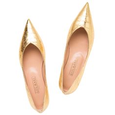 Gold metallic leather Pointed toe Leather lined Leather sole Made in Italy We maxed out style with these ultra sharp pointed toe dress flats. Accessorize with these one-of-a-kind pointed toe flats, now available in a gold crocodile-embossed leather. These fashionable metallic textured flats are so fun for date nights or to add a bit of class to your attire. Pair with a cream suit for some serious power at the office. Gold Shoes Flats, Cream Suit, Pointy Flats, Luxury Flats, Pointed Flats, Gold Flats, Crocodile Pattern, How To Make Shoes, Crocodile Leather