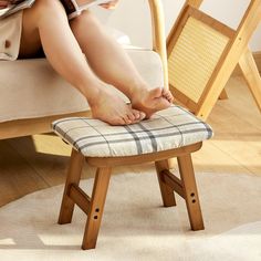 a person sitting on a chair with their feet up