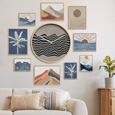 a living room filled with furniture and pictures on the wall above it's clock