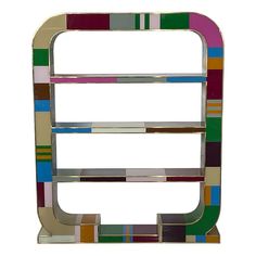 a multicolored metal shelf with three shelves