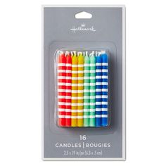 four different colored candles are in the package