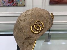 SHOP MORE LUXURY PRODUCTS HERE Description Gucci Canvas Baseball Hat Beige GG Hat Instantly recognizable emblems of the brand, logos enrich designs in new and unexpected ways. Behind every logo lies the tradition and value of the House, an everlasting medium one can wear again and again. BeigeBeige GG canvasLogo GucciAdjustable hook-and-loop closure on back Includes box, dust bag.This product is of the premium quality. Luxury Baseball Cap With Curved Brim And Logo, Luxury Logo Baseball Cap With Curved Brim, Luxury Snapback Hat With Embroidered Logo, Luxury Brown Hat With Embroidered Logo, Luxury Baseball Cap With Logo Patch, Luxury Hats With Logo Patch And Curved Brim, Designer Brown Hat With Embroidered Logo, Designer Adjustable Visor Hat, Adjustable Visor Hat With Logo