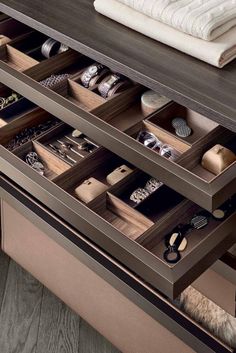 the drawers are open and neatly organized on top of each other in this modern dresser